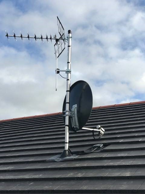 TV satellite installed on roof of house