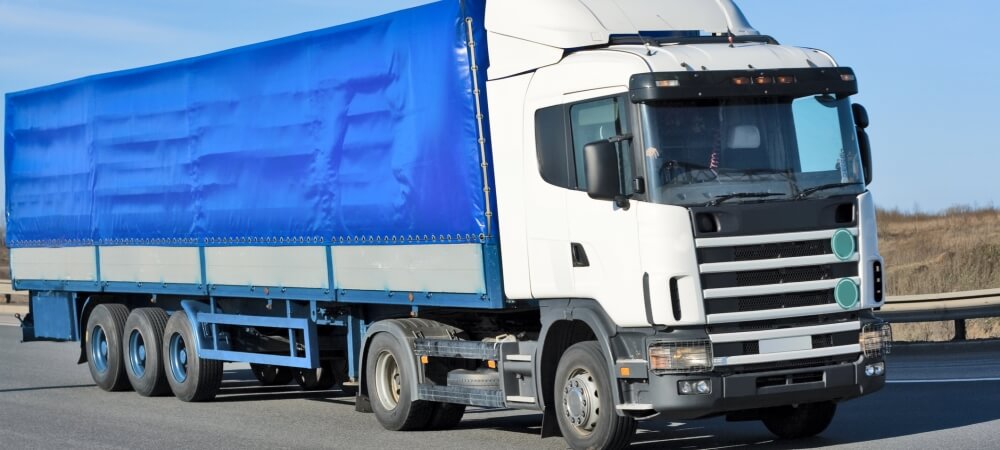 A Courier Truck with a Blue Cargo Bed
