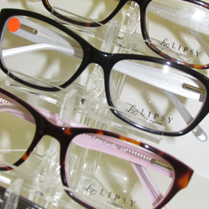 A close up of high-end frames laying in a display cabinet