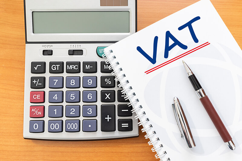 VAT on a notepad on top of a calculator