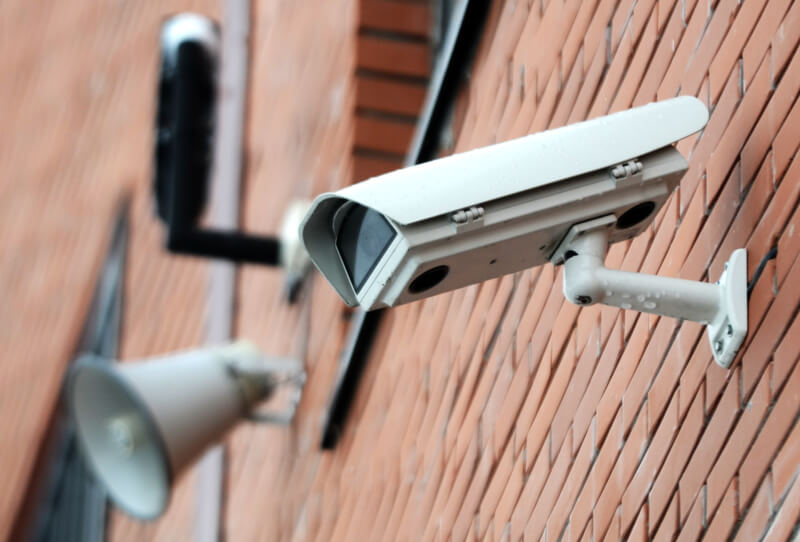 CCTV Security Camera mounted to brick wall