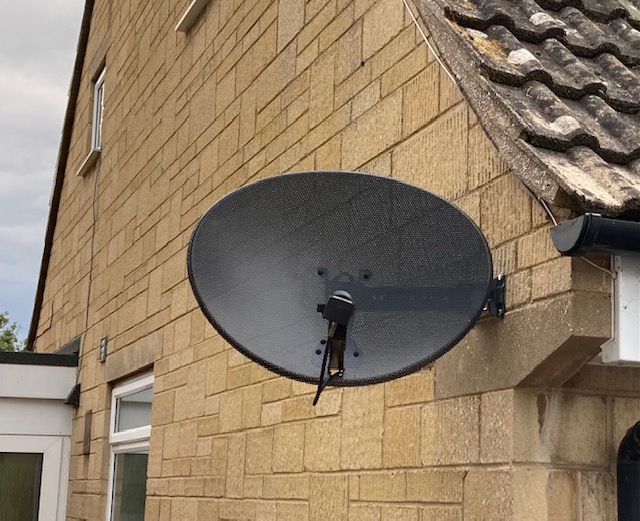 Satellite Dish Attached to a House