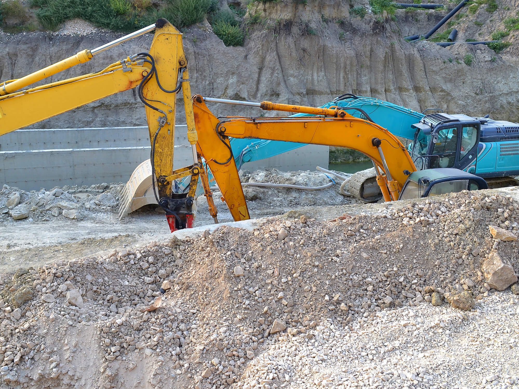 Two excavators in a site
