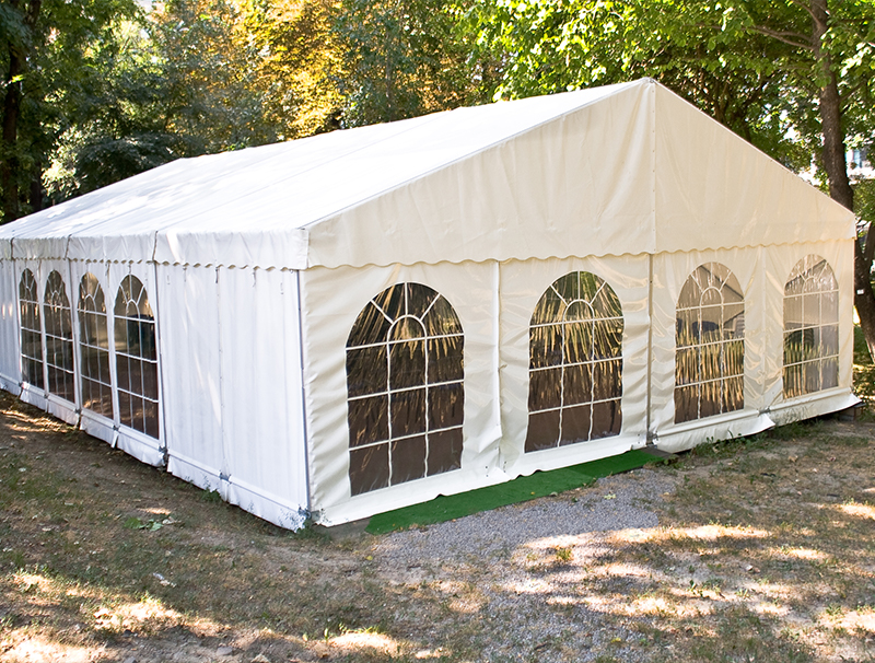 White big tent in forest