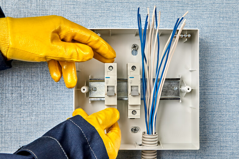electrical rewires in Dartford - Electrician rewiring a fuse box