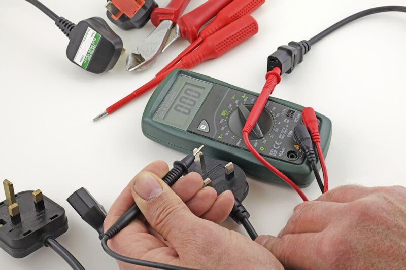 PAT testing in Dartford - Electrician testing plug with PAT Testing equipment