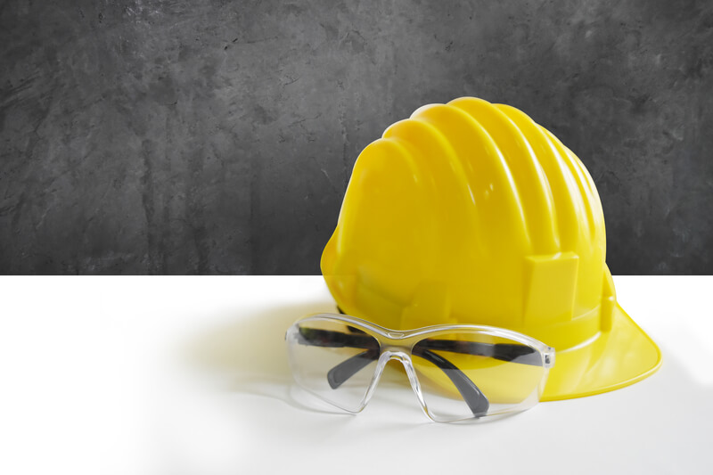 Yellow safety helmets and goggles