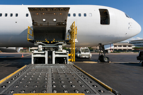 freight being loaded into aeroplane