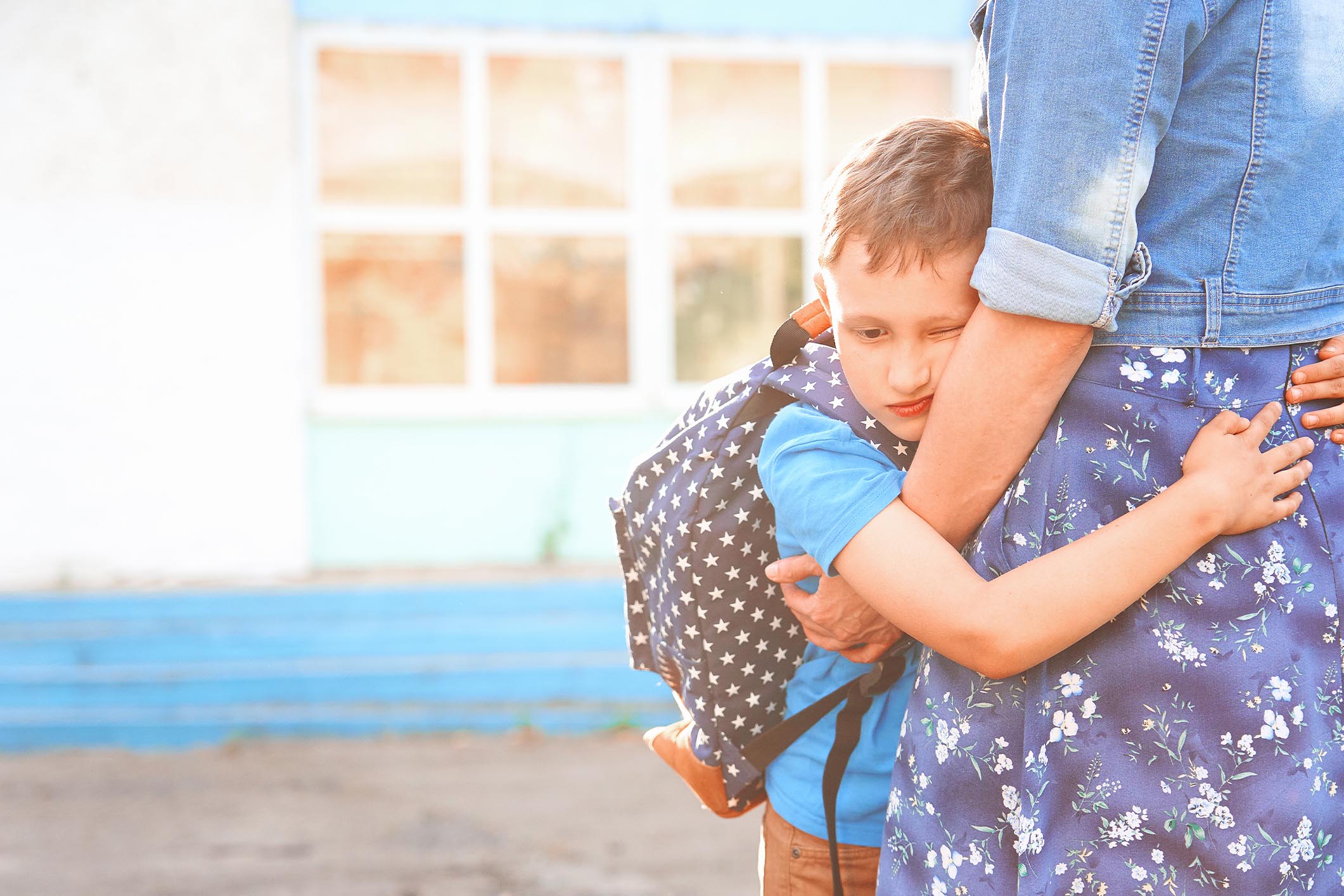 Child hugging parent