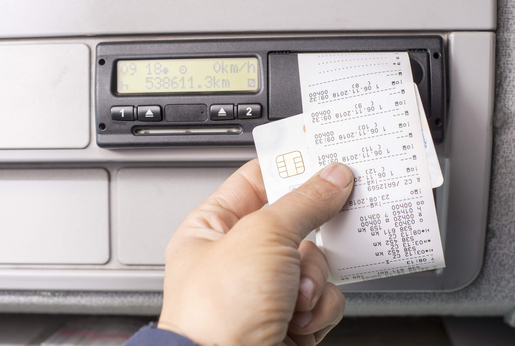Person retrieving print out of a tachograph machine