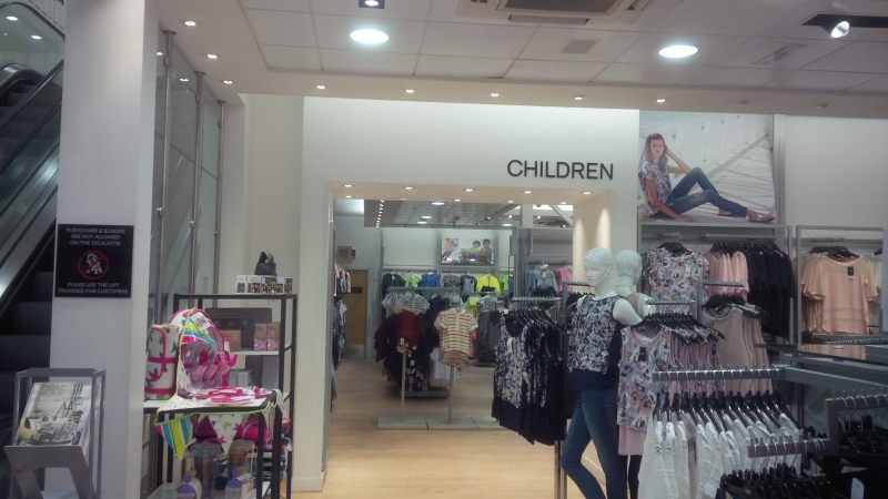 A modern decor in a childrens section of a clothes shop.