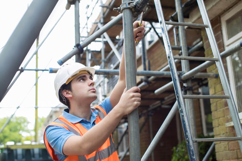 Employee building scaffolds