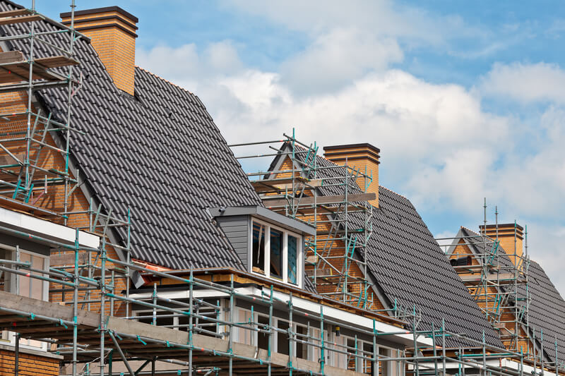 Houses with scaffolding attached