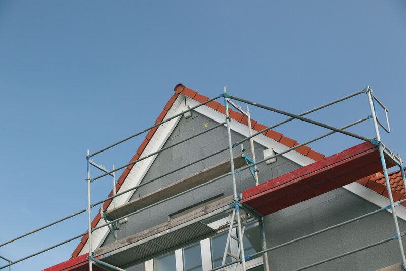 Roof with scaffolding around it