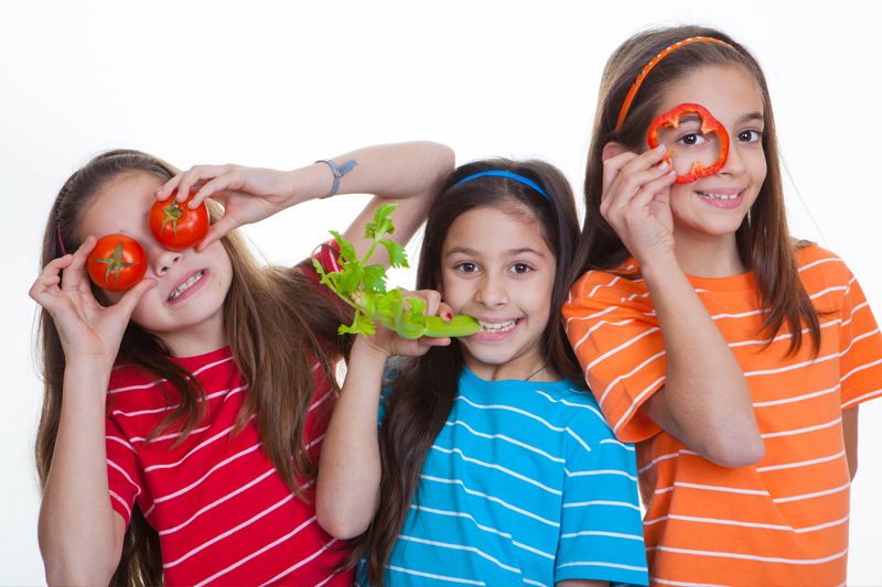Children eating healthy salad vegetable diet