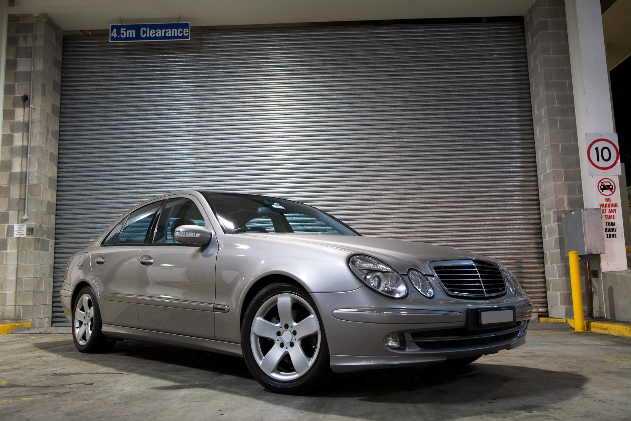 A sports sedan in a mechanics garage