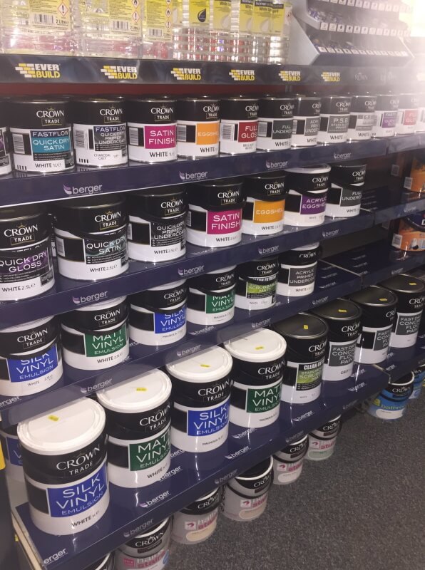 Several Brands of paint on a shelf