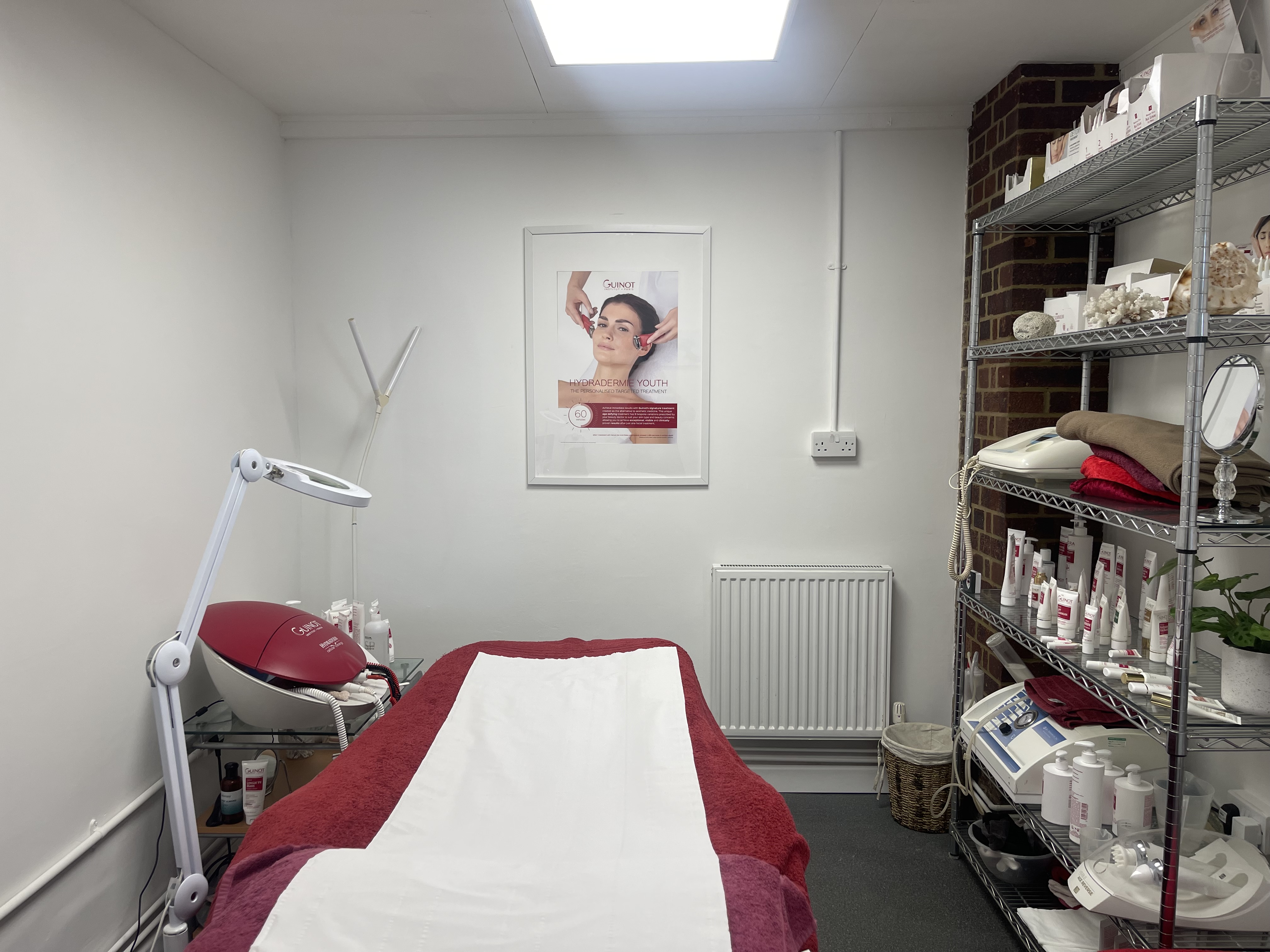 Massage table, with shlf containg necessary spplies