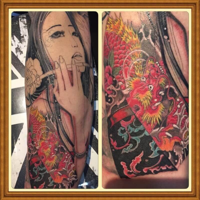 Arm with tattoo of lady smoking and a red Japenese Dragon.