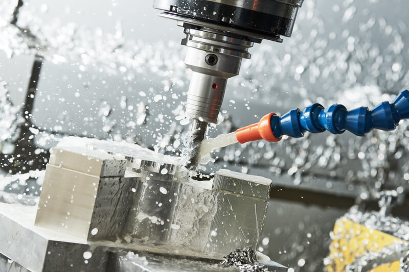 Industrial CNC machining of metal detail by cutting end-tooth vertical mill at factory