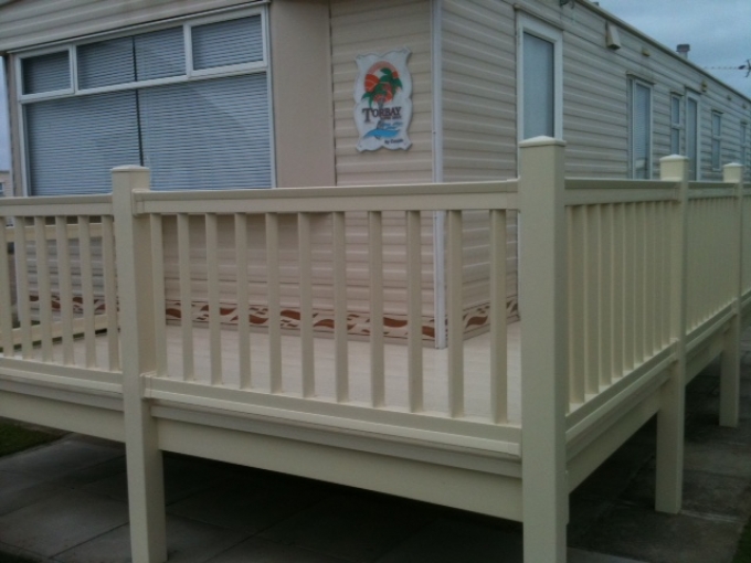 White Static caravan with composite decking