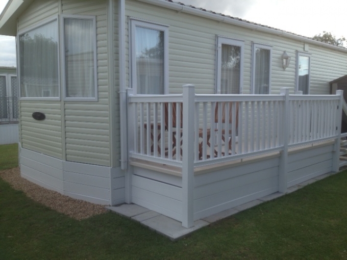 White Static caravan with decking