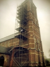 Scaffolding erected around a church tower