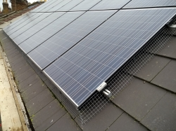 Bird proofing mesh around the base of solar panel install, hertfordshire