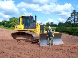 Bulldozer with wide low ground pressure tracks, ideal for finishing work and working on soft ground.