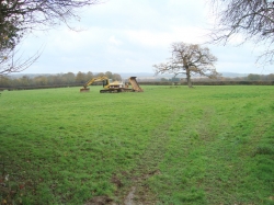 The Large oak tree in the middle of the field was left on one of the islands. Firstly we stripped off all the topsoil and putting it all in the middle of the site...