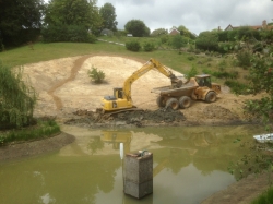 We then start to remove the remainder of the slipped ground and re-shape the lake edge