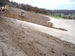 Spreading topsoil on a very shapely bank on a golf course in Surrey where we re-shaped a fairway.