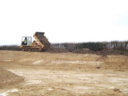 We used our tracked dumper to place the topsoil on the banks as it doesn't mark the ground...