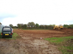 This is the site, its two fields with a hedge row going through the middle. Just stripping a bit of soil with the D8...