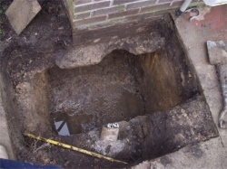 The drain had been leaking for a long time and had softened the clay soil beneath the foundations, this was dug out and locally underpinned then the drain repaired and the brickwork re-pointed.