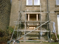  The scaffold had to be capable of supporting the front elevation whilst the lintel was changed and also to be used as a working platform, the old lintel was lowered onto rollers on the scaffold and slid out, it then had to be cut into smaller pieces to enable it to be manhandled to ground level.  