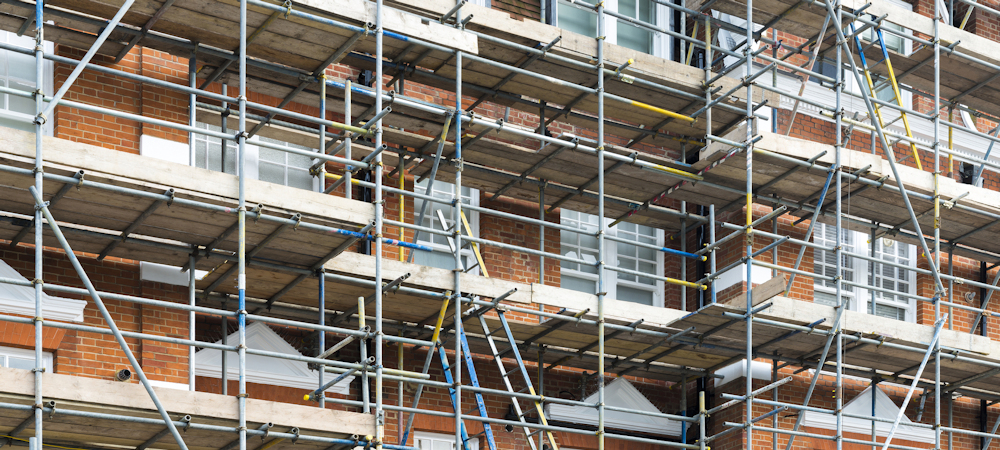 Scaffolding against block of flats ready for building work