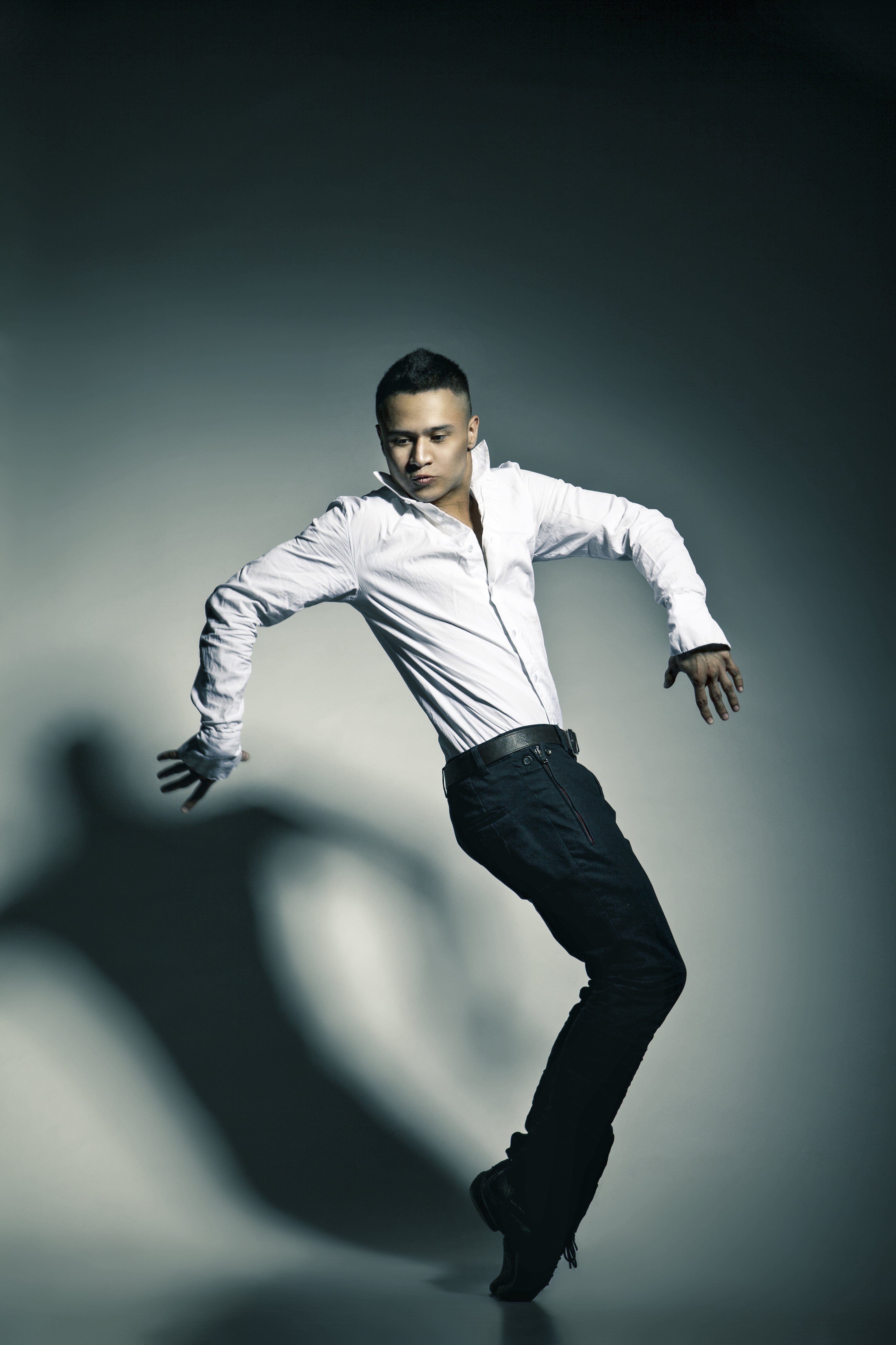 modern jazz dancer in front of a grey backdrop